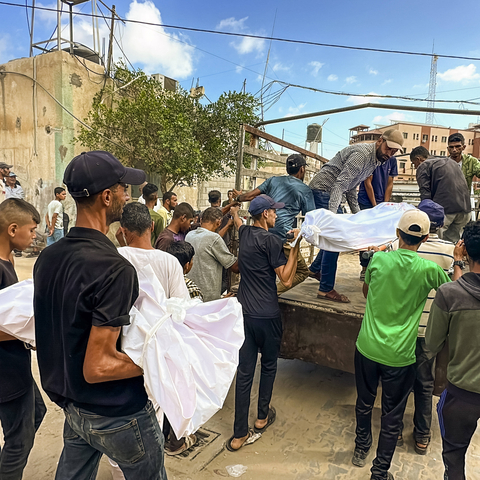 Mourners Grieve Gaza Aid and Shelter Victims Palestinians mourn over the bodies of victims killed in airstrikes during a funeral in Rafah in the southern Gaza Strip on July 31, 2025. Eighteen people were killed while waiting for humanitarian aid at a US aid distribution point in the Morag area of Rafah, according to local health officials. In a separate strike, six Palestinians were killed when a tent housing displaced persons was hit in the Mawasi area of Khan Yunis.