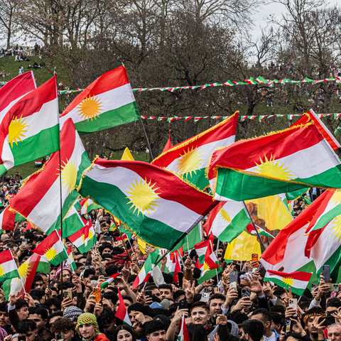 Kurds demonstrate with the flag of Kurdistan (also called Ala Rengin) on Saturday (March 23, 2026) in the Rheinaue park in Bonn for their own state of Kurdistan and celebrate the New Year and spring festival of Newroz. 