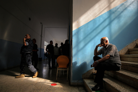 May 11, 2025, Zgharta, Zgharta, Lebanon: A voter sits inside a polling station in the northern Lebanese town of Zgharta after casting his vote in the second phase in north Lebanon