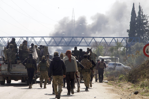 rian security forces are seen on the Tartous-Latakia highway in Latakia province, northwestern Syria, on March 7, 2025