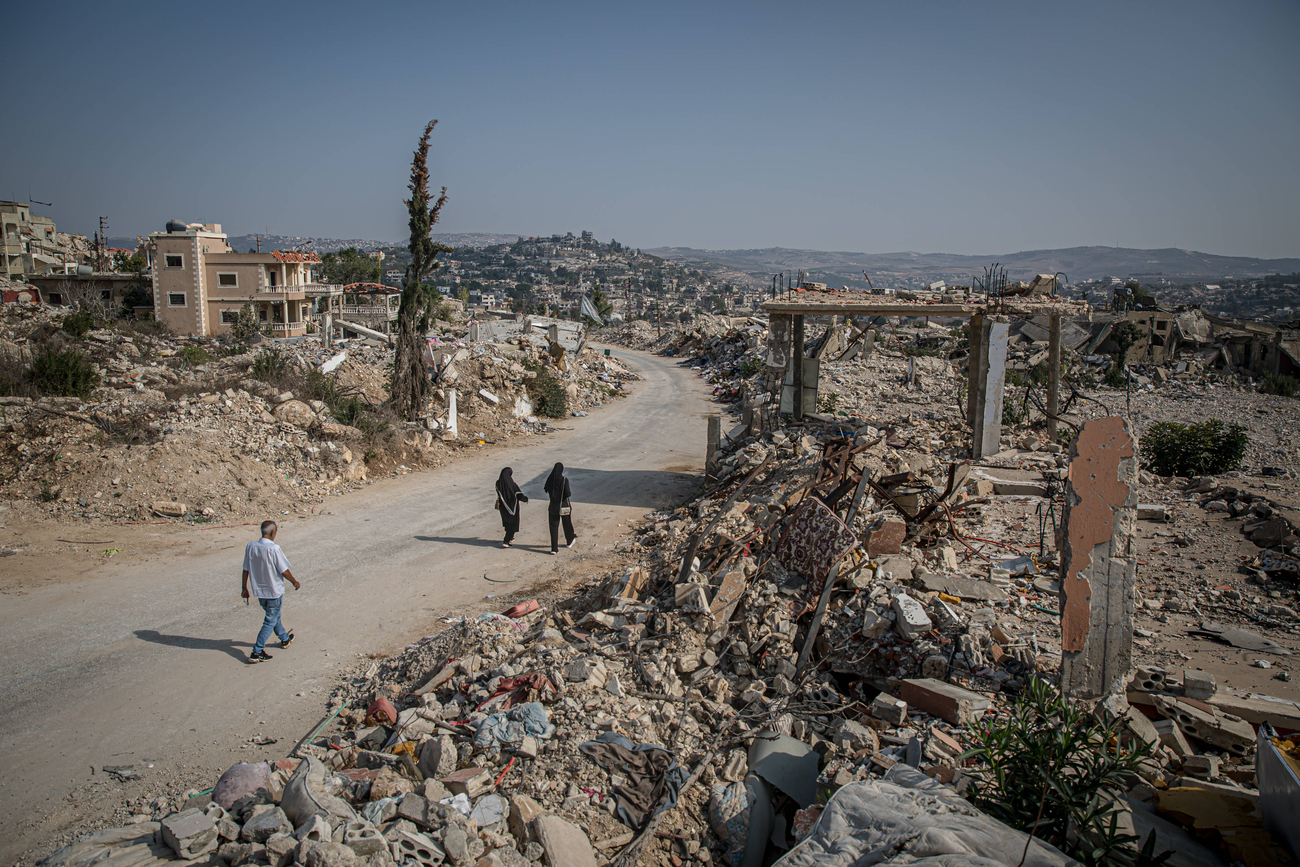 November 8, 2025, Lebanon: Visiting residents walk down a street in the mostly destroyed Lebanese village of Ayta al-Shaab. November 27, 2025, will mark the first anniversary of the ceasefire between Israel and Hezbollah. By the beginning of November 2025, UNIFIL recorded almost 7,100 Israeli air violations of UN resolution 1701. UNIFIL also said there had been more than 2,400 activities by the IDF inside of Lebanon, while they had discovered around 360 weapons caches - mostly presumed to belong to Hizbull