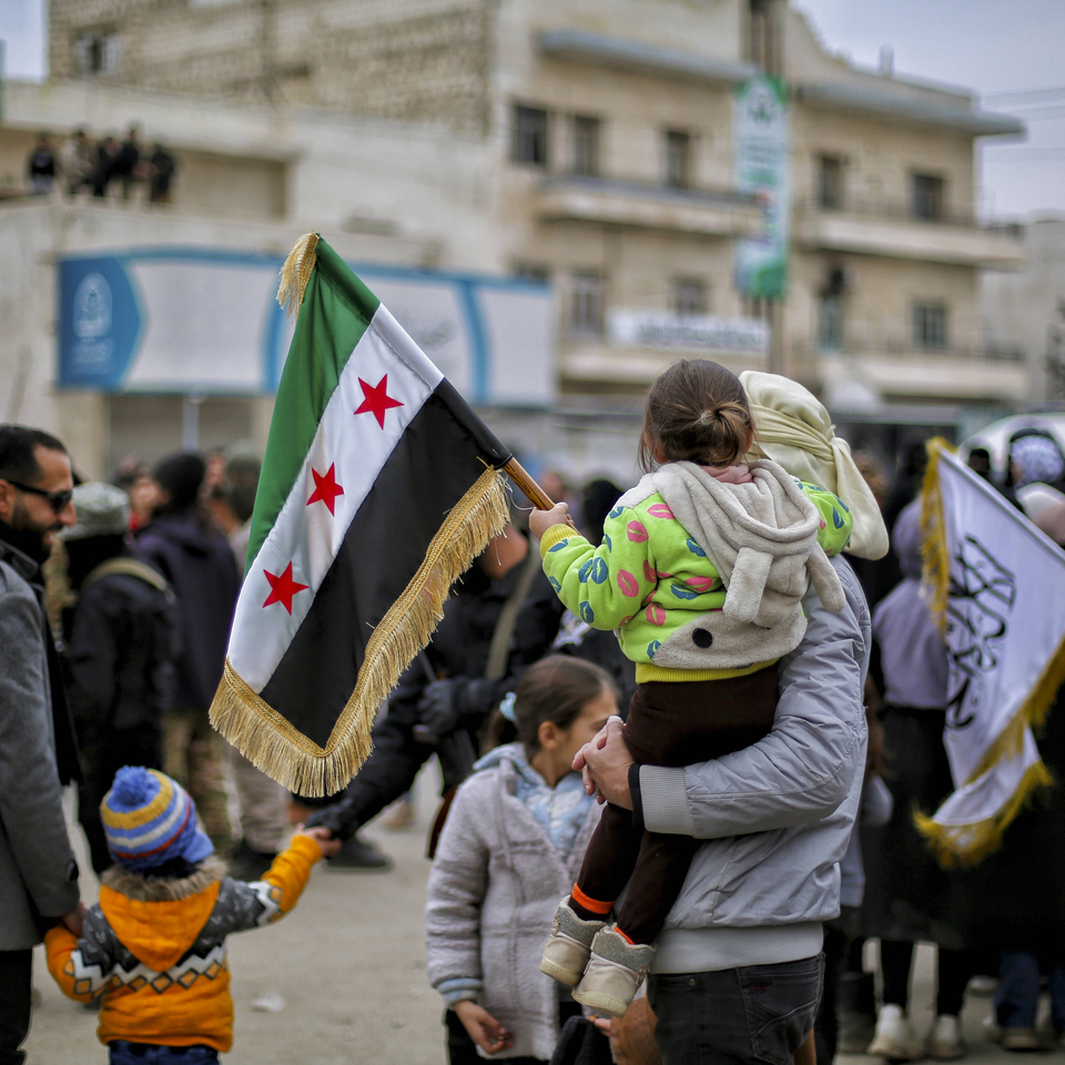 Syrians Celebrate Assads Ouster A man carrying a child walks among the crowd during celebrations in Idlib, Syria, on January 31, 2025. Syrians have taken to the streets in celebration following the ouster of Bashar al-Assad. Idlib Idlib Syria Copyright: xBilalxAlhammoudx
