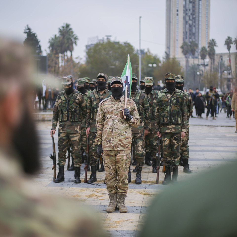 Syria Conflict Security Graduation Graduates of Syria s General Security forces under the country s new administration attend a ceremony in the northern city of Aleppo on February 12, 2025. Syrian interim President Ahmed al-Sharaa said in an interview released on February 10, that thousands of people were joining the country s new army following the overthrow of Bashar al-Assad and the dissolution of his military. Since the fall of longtime ruler Assad in December, Syria s authorities have dissolved the for