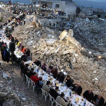 Breaking the fast: around 400 people dine among the remains of their homes, which were destroyed in Israeli airstrikes during Ramadan. (Kfar Shouba, Lebanon, 17.3.2025)
