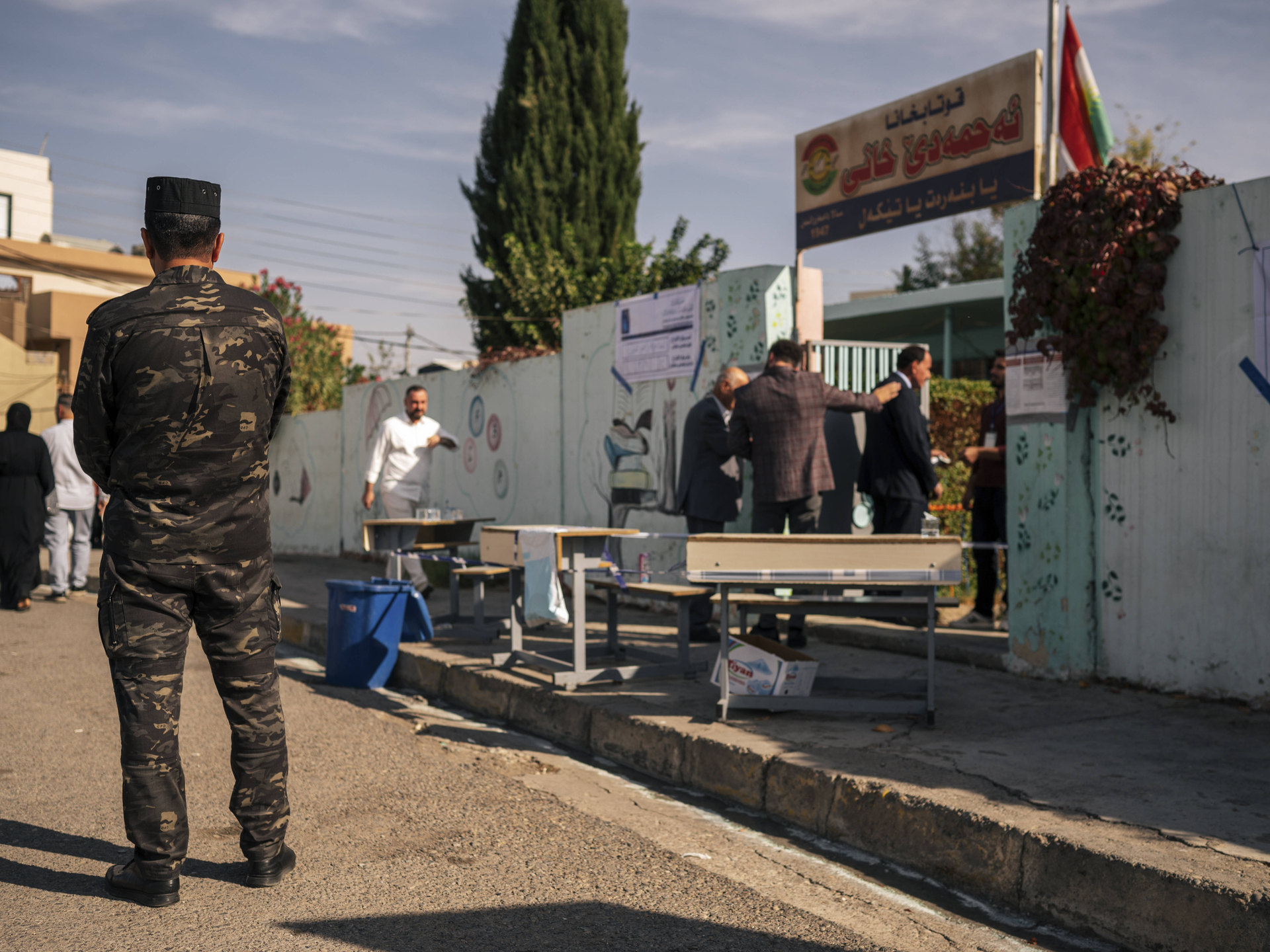 Voters Cast Ballots in Zakho Voters arrive at a polling station during the parliamentary elections in Zakho, Dohuk Governorate, Kurdistan Region, Iraq, on November 11, 2025. Security forces were deployed near polling stations to maintain order during the vote. (IMAGO / Middle East Images)