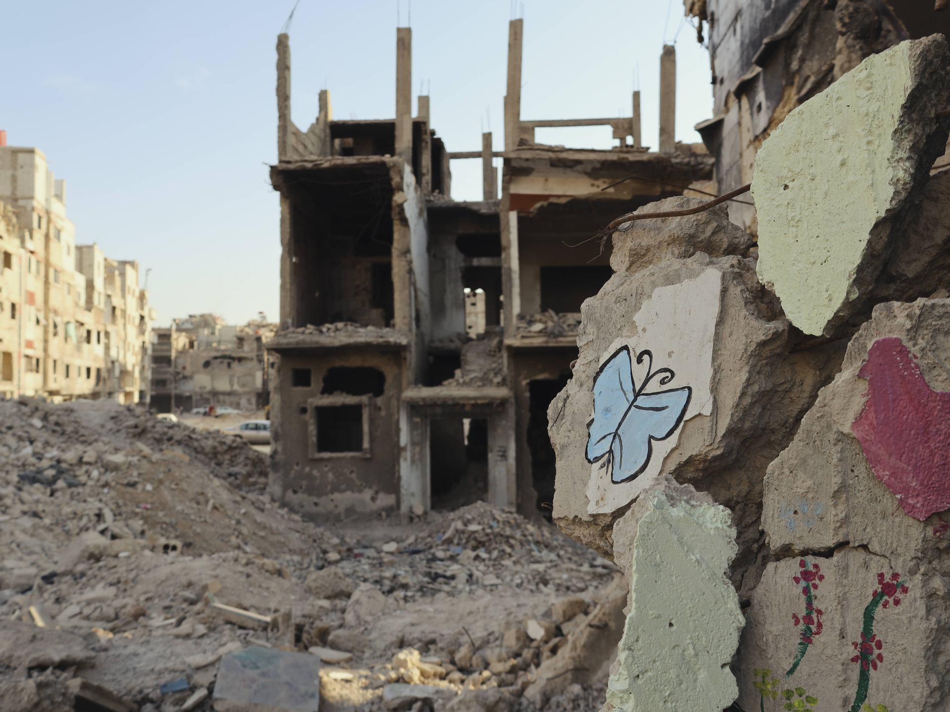 Life Returns to Damascus District A view shows the remains of heavily damaged apartment buildings in Yarmouk camp, Damascus, Syria, on November 8, 2025. Established in 1957, Yarmouk was once the largest Palestinian refugee community in Syria, but years of conflict left much of it in ruins.