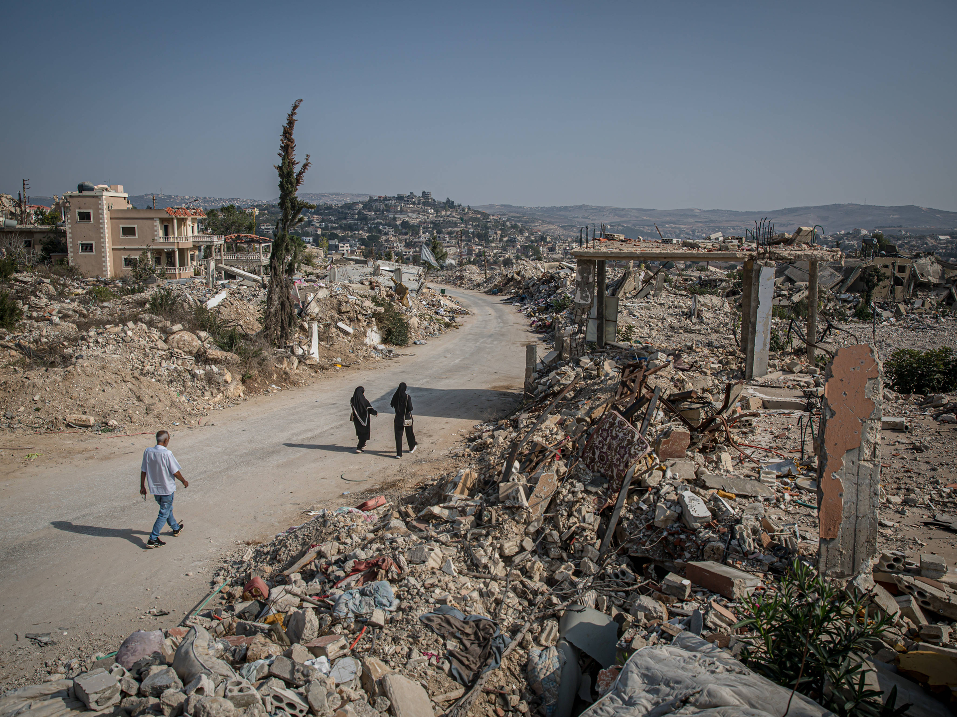November 8, 2025, Lebanon: Visiting residents walk down a street in the mostly destroyed Lebanese village of Ayta al-Shaab. November 27, 2025, will mark the first anniversary of the ceasefire between Israel and Hezbollah. By the beginning of November 2025, UNIFIL recorded almost 7,100 Israeli air violations of UN resolution 1701. UNIFIL also said there had been more than 2,400 activities by the IDF inside of Lebanon, while they had discovered around 360 weapons caches - mostly presumed to belong to Hizbull